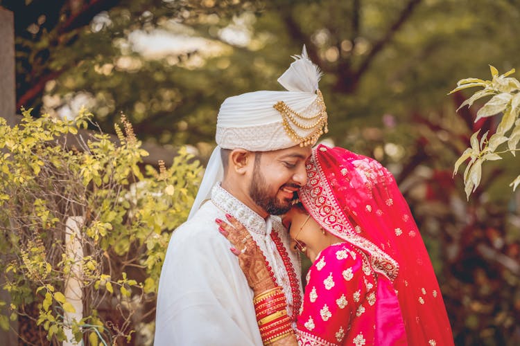 A Couple In Their Wedding Clothes