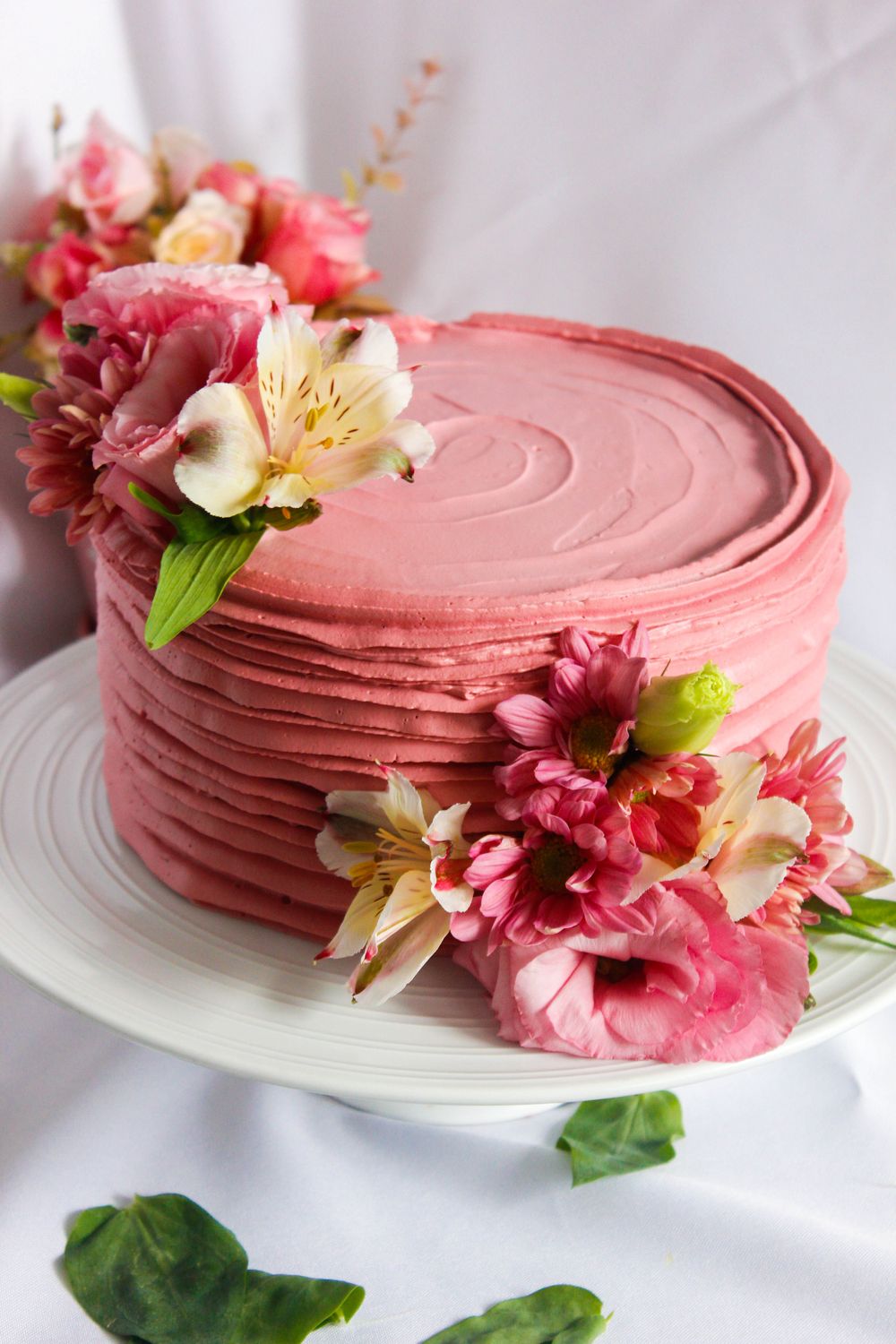 Pink floral celebration cake with hand-piped buttercream roses
