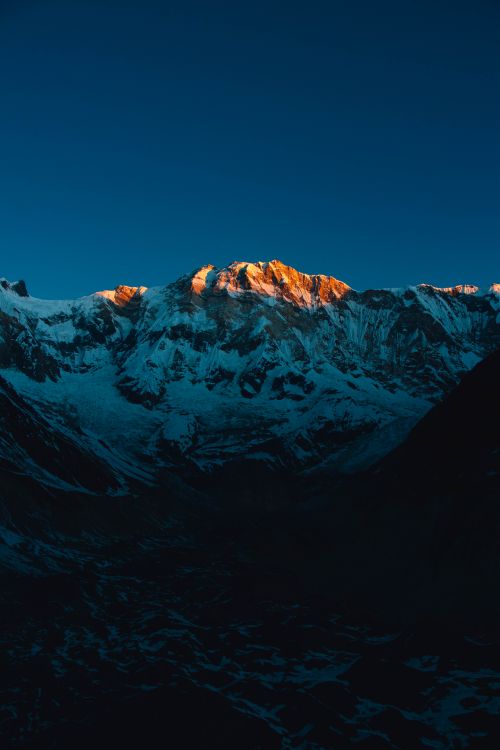 Free Stunning view of Annapurna mountain range with sunrise lighting the snow-capped peaks. Stock Photo