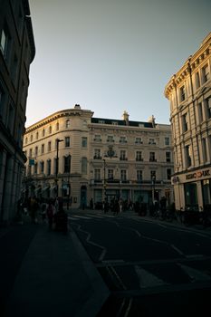 Explore Regent Street's architectural charm in London as dusk descends, featuring classic urban elegance.