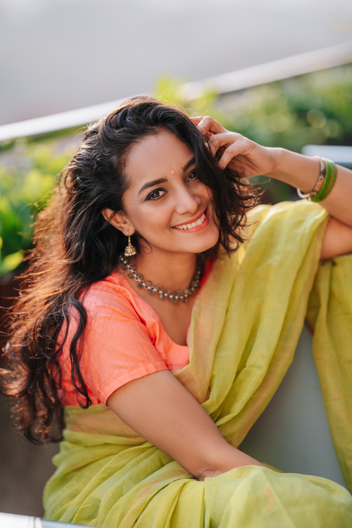 Free Bright and cheerful image of a woman in traditional attire, highlighting vibrant cultural fashion. Stock Photo