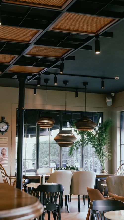 Free Charming café setting with contemporary decor and elegant lighting. Stock Photo