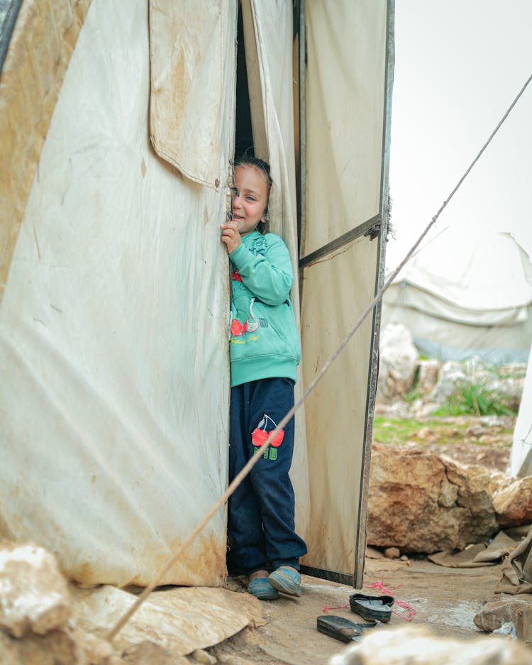 Cute Girl Peeking From A Tent 