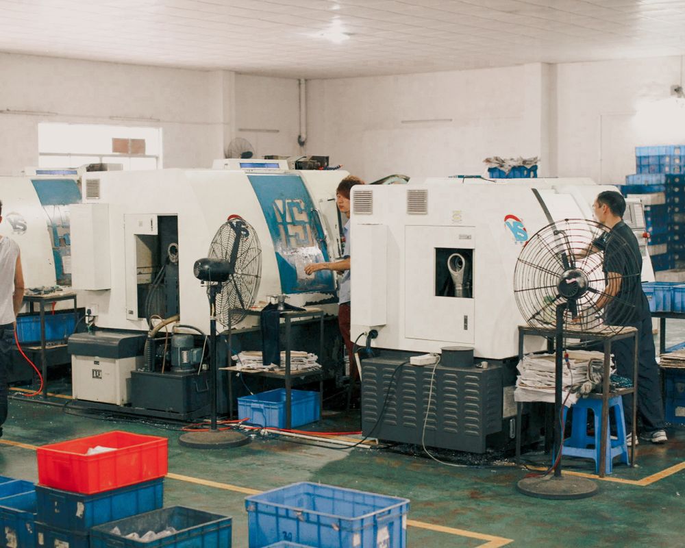 Workers operating machinery at PrimePlast Industries