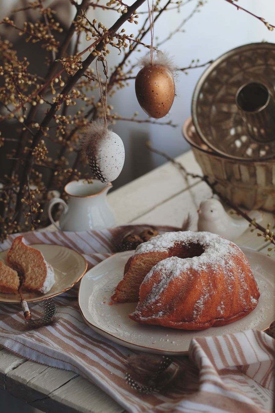 A sugar-dusted kougelhopf with its fluted mould