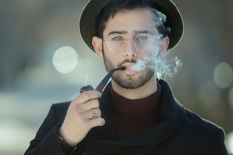 Portrait Of Man Smoking Pipe