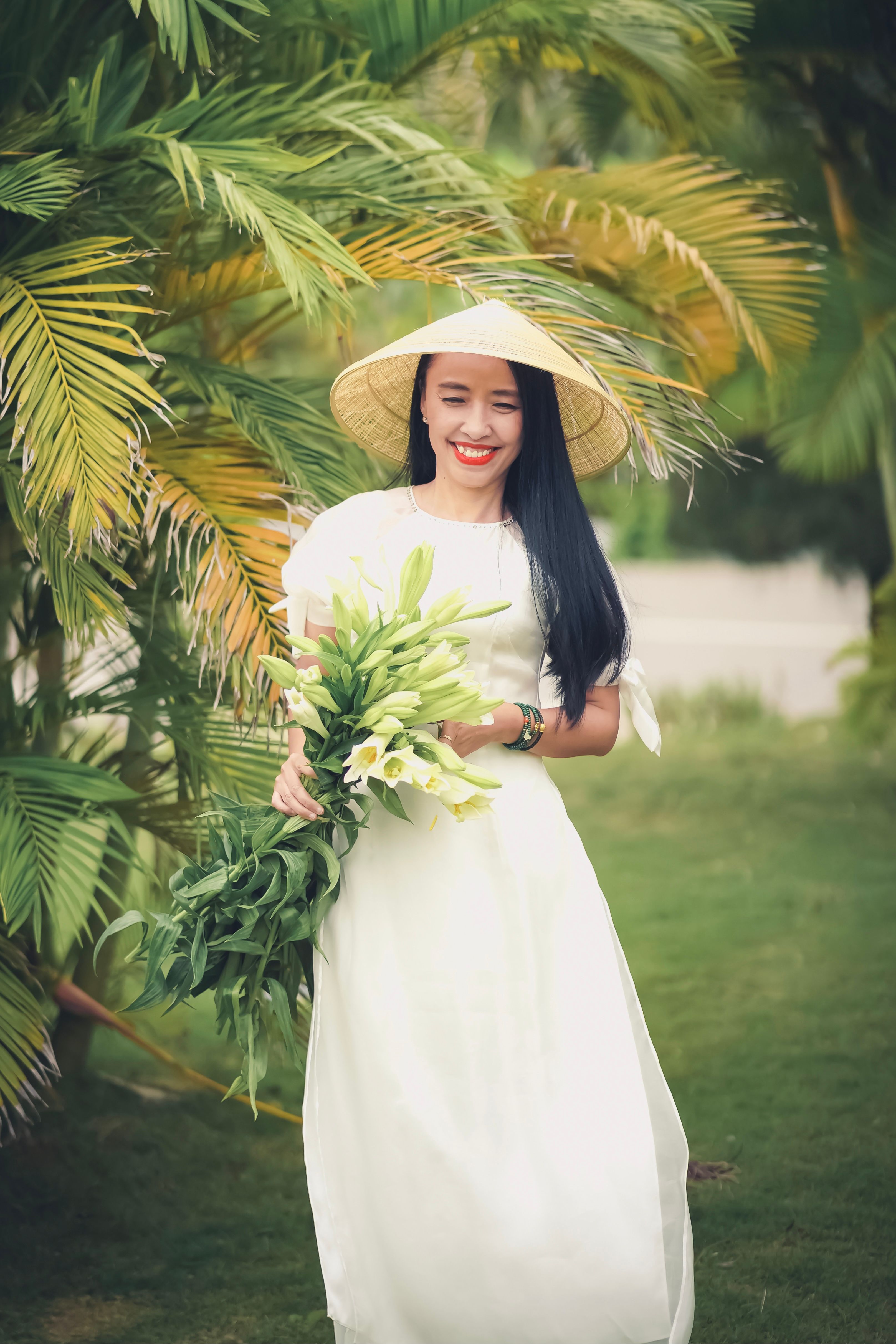 Beautiful Woman in White Dress and a Conical Hat · Free Stock Photo