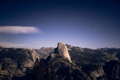 Free Majestic view of Half Dome under stars in Yosemite National Park at night. Stock Photo