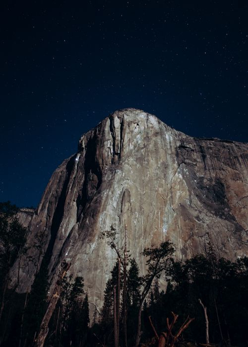 Free Majestic view of El Capitan rock formation under a starry night sky in Yosemite National Park. Stock Photo