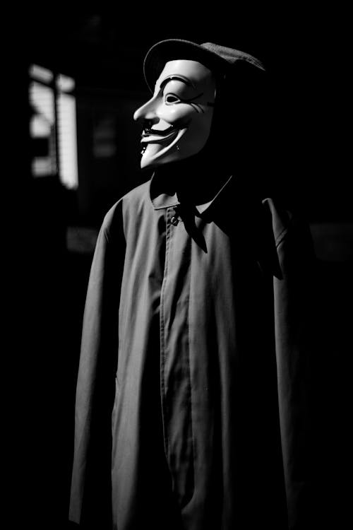 Grayscale Photo of a Person Wearing Mask