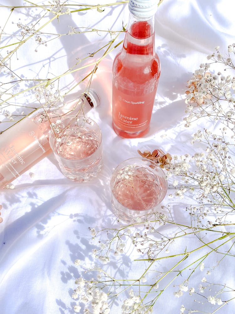 Pink Drink On A White Satin Tablecloth