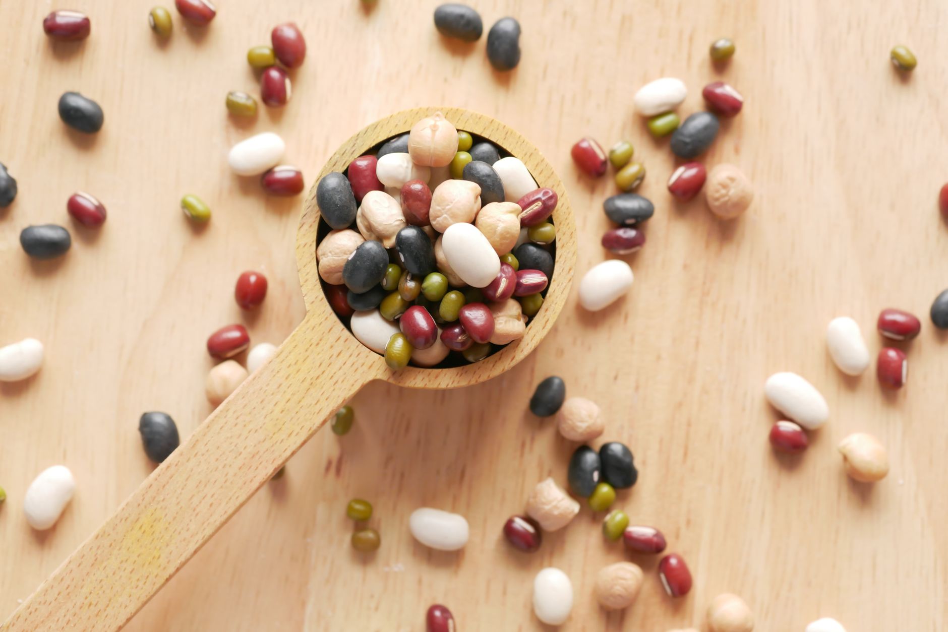 Plant-based protein powder and nuts on kitchen table