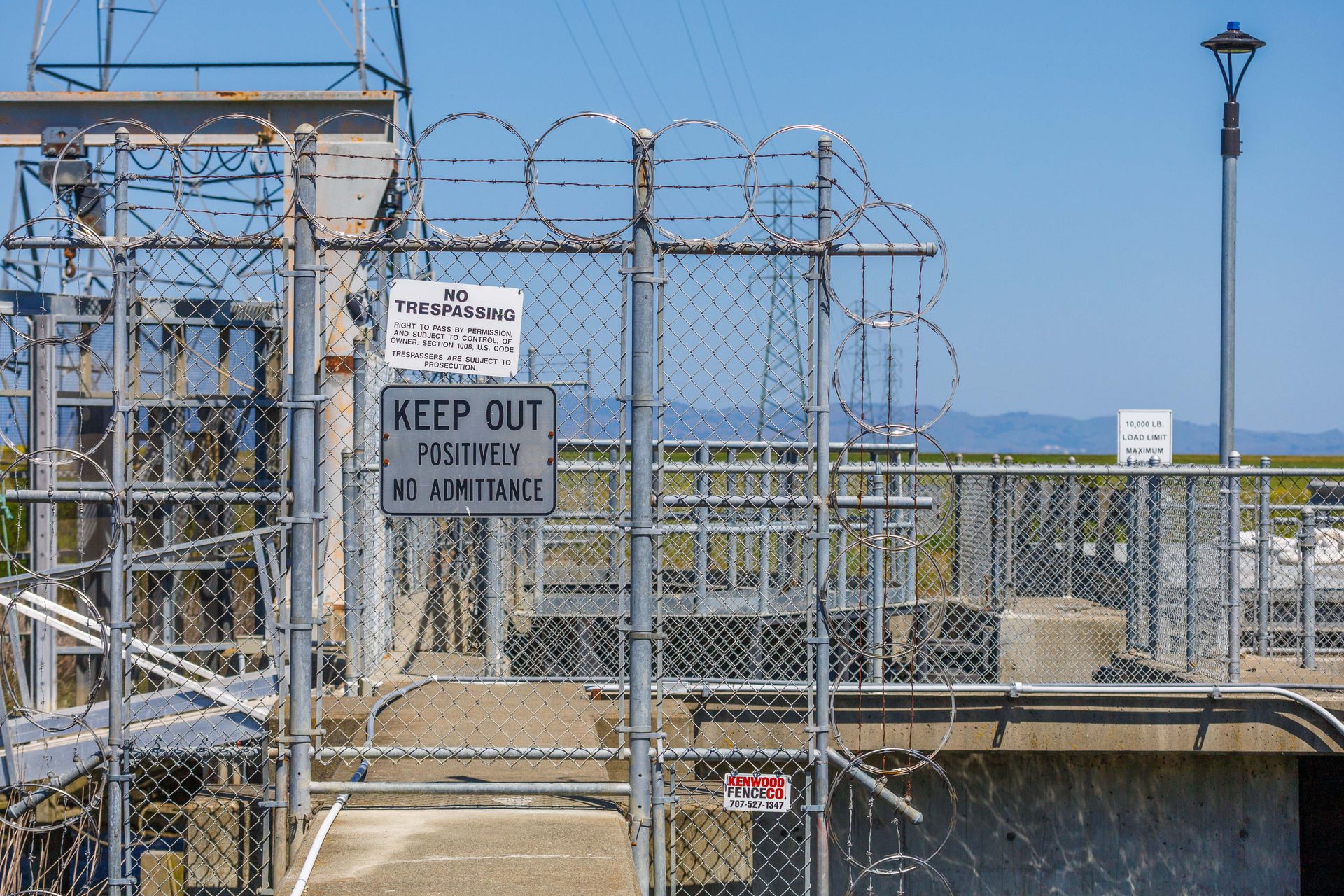 Signs on Chain Link Fence