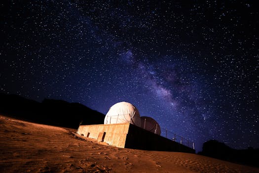 Stunning view of the Milky Way galaxy above a desert observatory under a starry night.