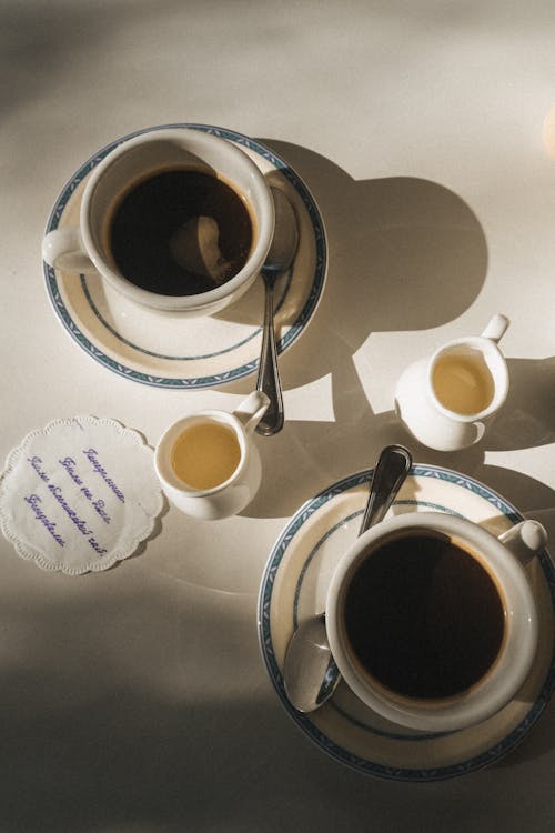 Free White Ceramic Mug With Coffee on White Table Stock Photo