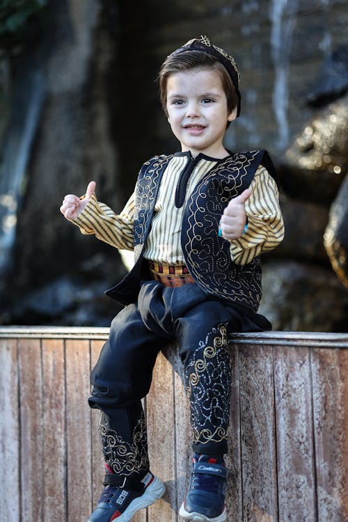 Adorable Child wearing Traditional Clothes