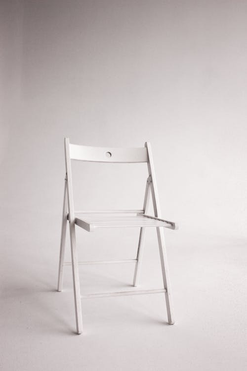 White Wooden Chair in Grayscale Photography