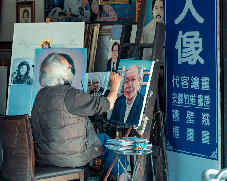 Elderly Man Doing Portrait Painting