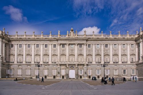 Free Explore the grandeur of a historic baroque palace facade under a clear blue sky. Stock Photo