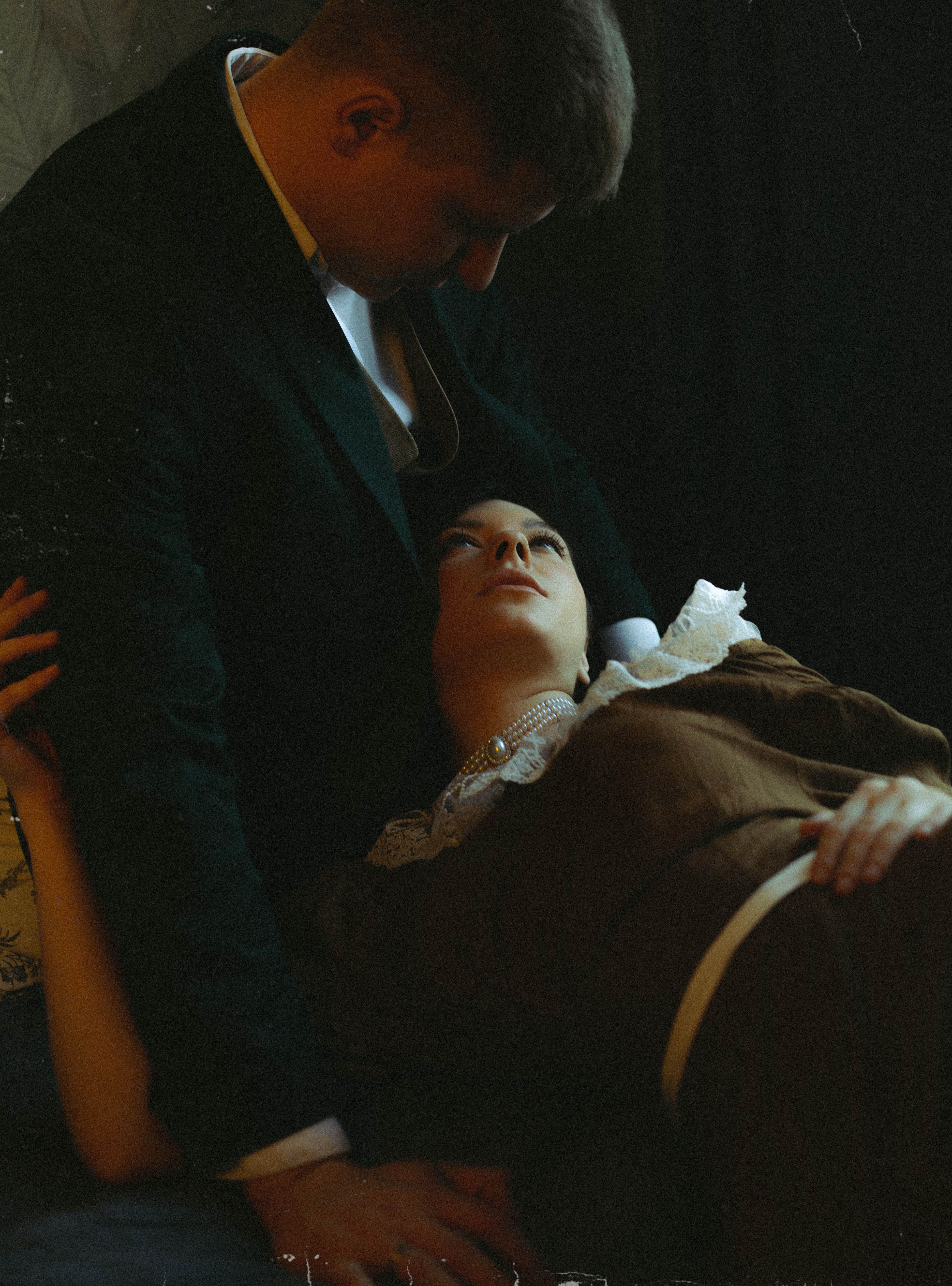 Couple sharing a tender moment indoors in Saint Petersburg, Russia.