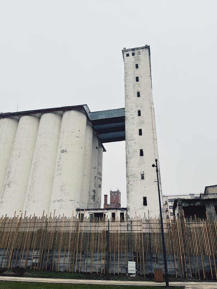 Fence And Building With Silos