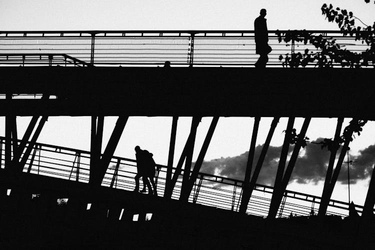 Silhouette Of Bridge And People