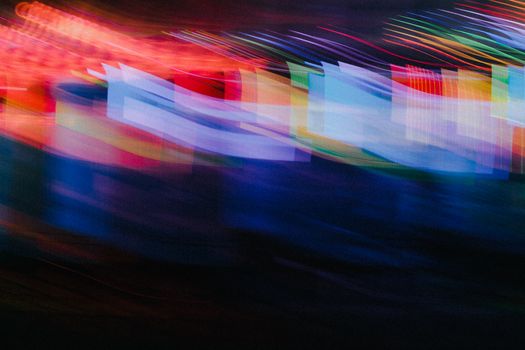 Dynamic abstract light streaks create a colorful motion effect, perfect for creative backgrounds.