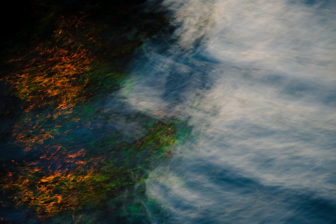 Aerial Shot of Fog Over Water