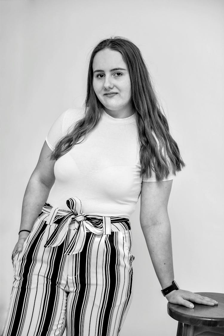 Woman Leaning On A Stool