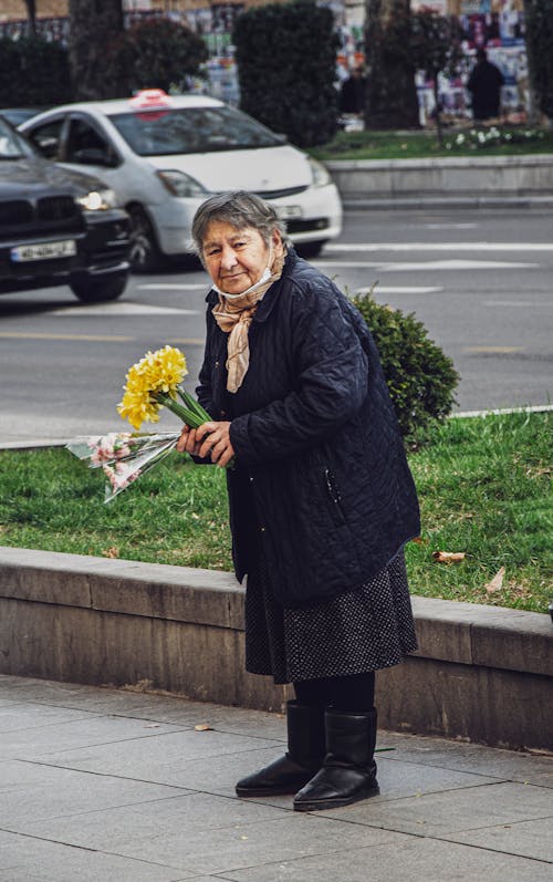 Elderly Woman selling Flowers 