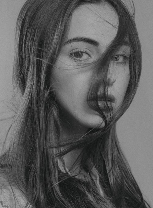 Free Monochrome close-up portrait of a woman with flowing hair in Kyiv. Stock Photo