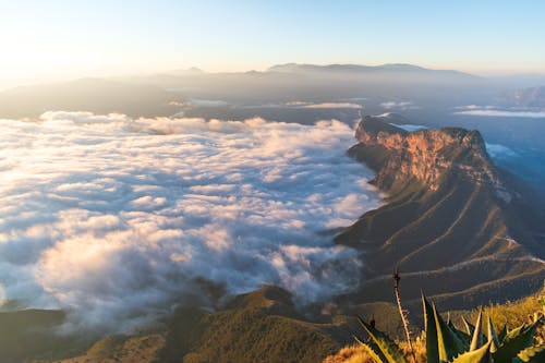 Aerial View of Mountains Overs the Clouds