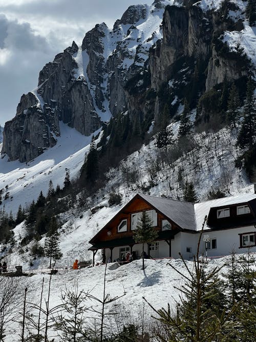 House Beside a Rocky Mountain