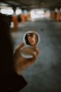 Woman Looking at Her Compact Powder Mirror Reflection