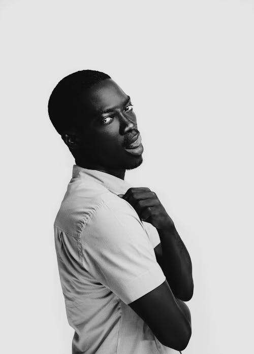 Portrait Of African-American Man In Shirt Licking His Lips