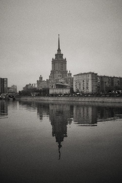 Free Black and white photo of Moscow's Stalinist architecture reflected in a river. Stock Photo