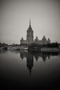 Grayscale Photo of Building Near Body of Water