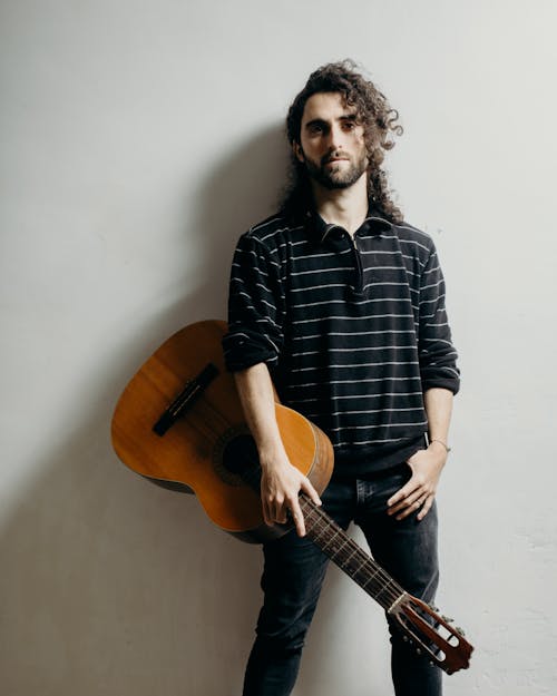 Man carrying Accoustic Guitar 