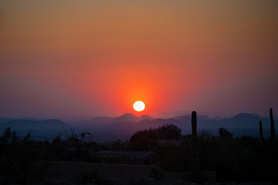 Scenic View of Sunset over Mountains 