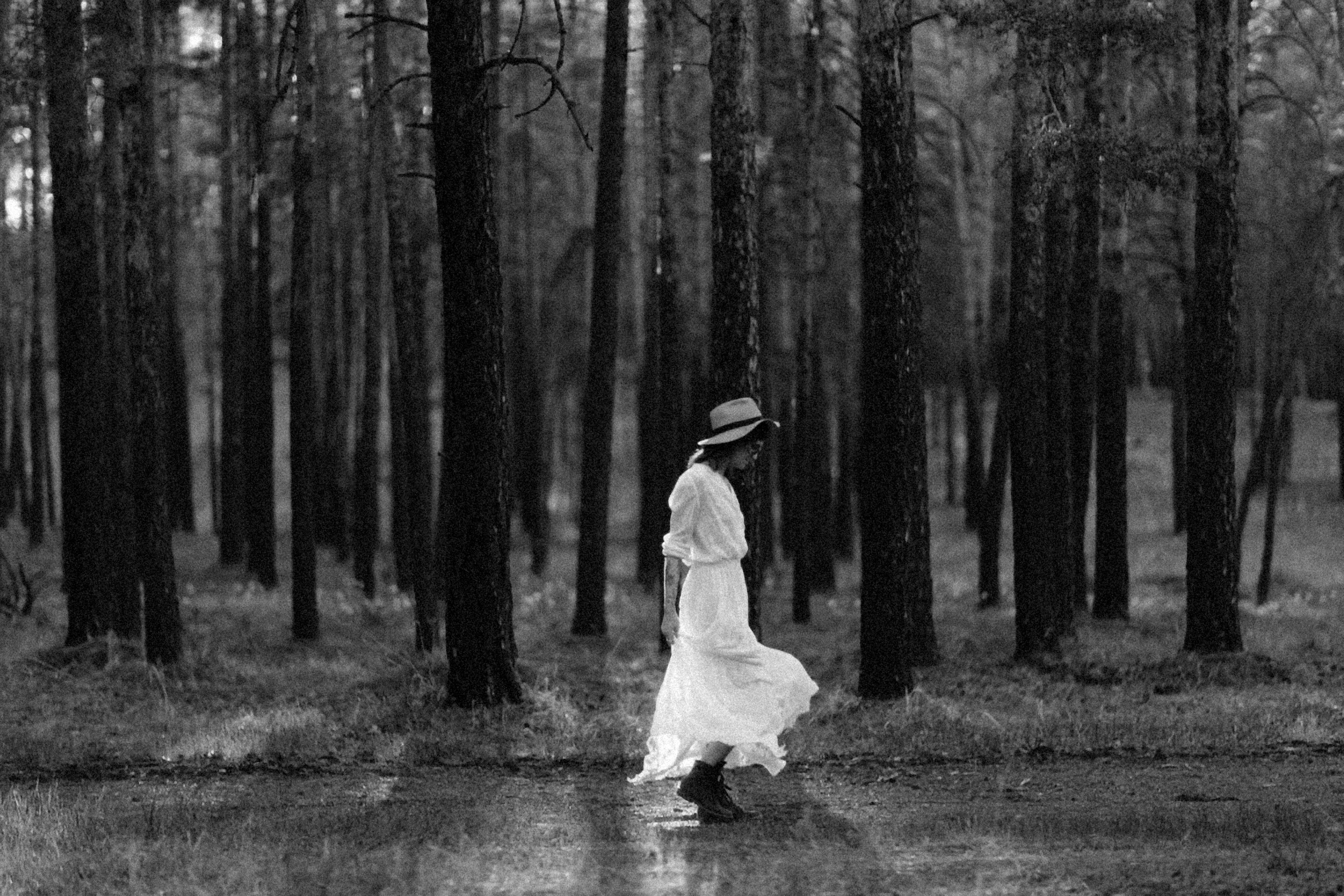 Grayscale Photo of Woman in White Dress Walking on Forest · Free Stock ...