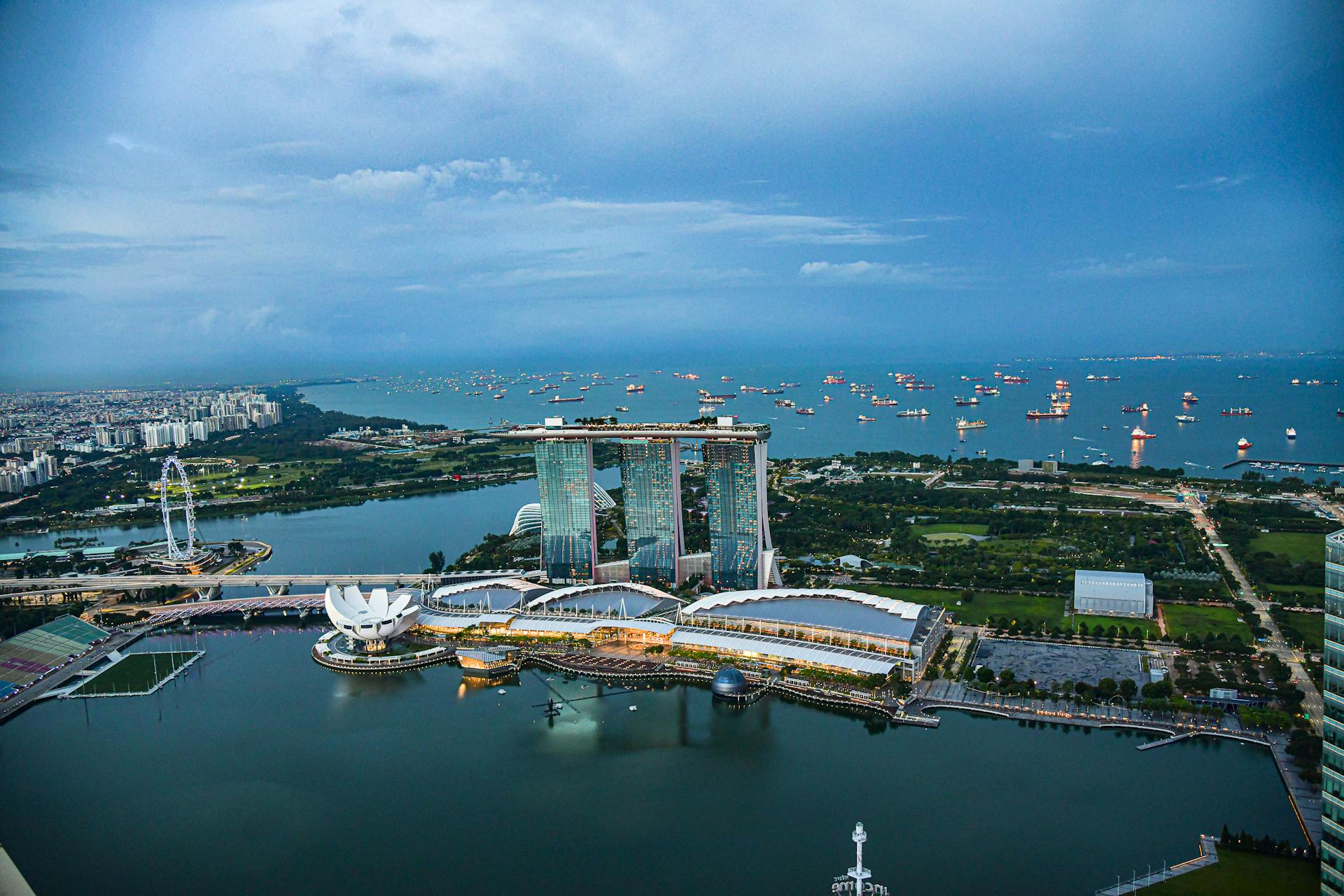 A breathtaking aerial view of Marina Bay Sands and Singapore skyline at dusk.