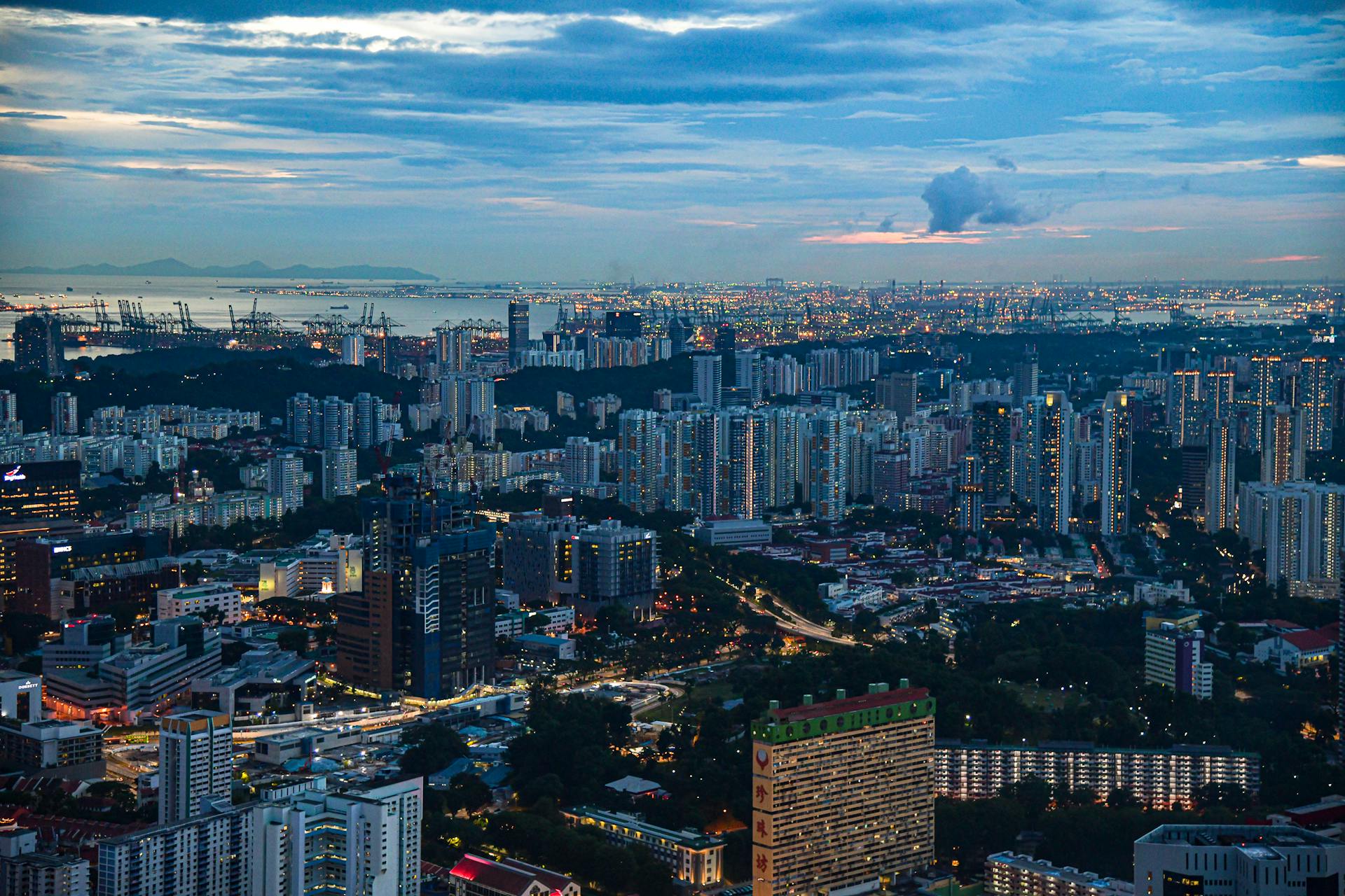 Skyline of Singapore at dusk showcasing urban buildings and scenic city lights.