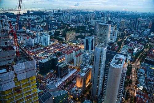 Free Stunning aerial view of Singapore's urban skyline at dusk, showcasing modern architecture Stock Photo