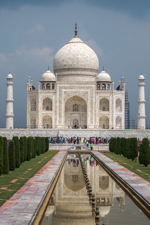 Free A stunning day view of the Taj Mahal with reflecting pool and tourists, in Agra, India. Stock Photo