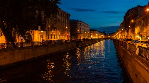 Free Charming night view of an illuminated canal in St. Petersburg, Russia with historic buildings. Stock Photo
