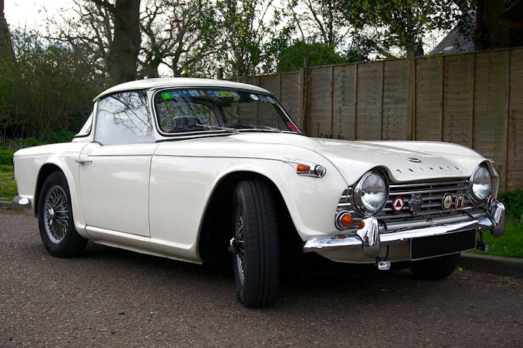 A Classic Triumph Car On The Roadside