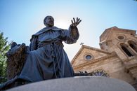 A Man in Black Robe Statue
