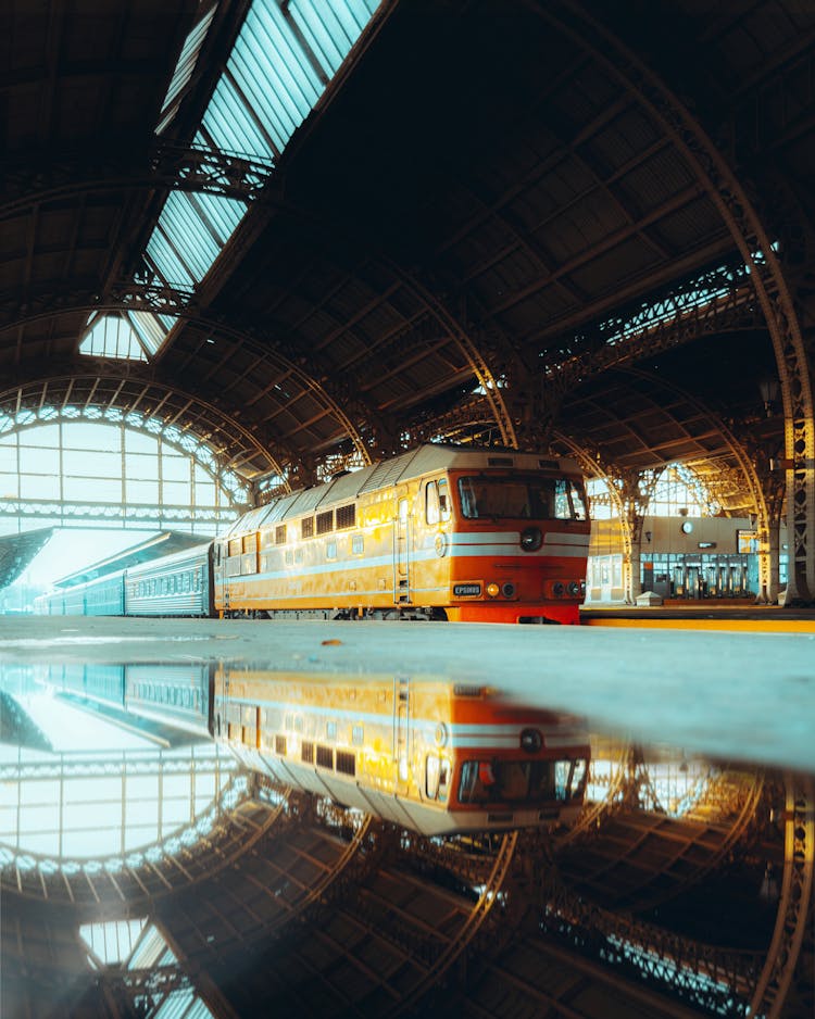  A Yellow Train Arriving At Saint Petersburg, Russia Train Station