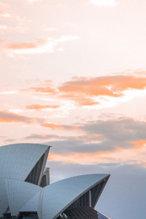 Free Beautiful sunset clouds over Sydney Opera House, iconic landmark photo. Stock Photo