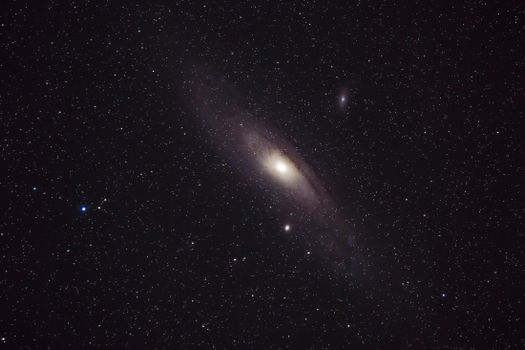 Captivating view of the Andromeda Galaxy with a sparkling star field captured in the depths of space.